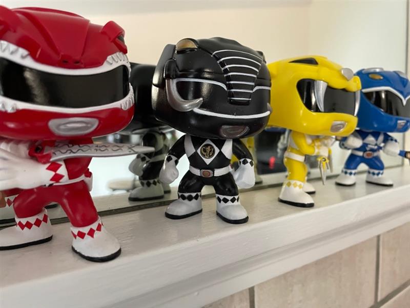 Red, Black, Yellow, and Blue Pop! Power Rangers lined up on a shelf